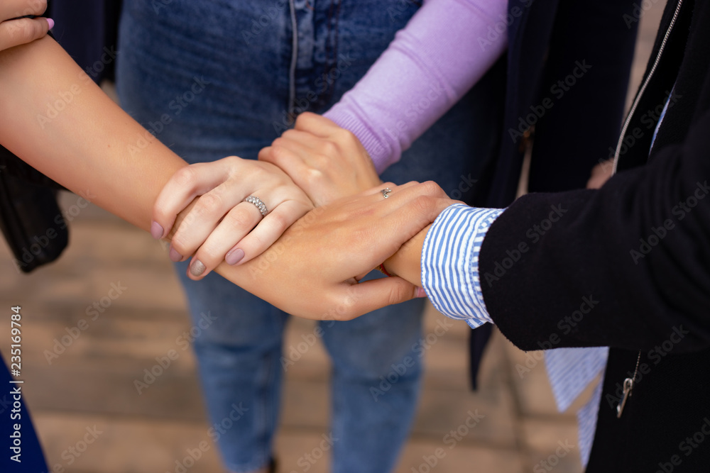 Close up of high five hand gesture, symbol of common celebration or greeting. Success and teamwork concept