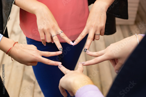 Close up of high five hand gesture, symbol of common celebration or greeting. Success and teamwork concept