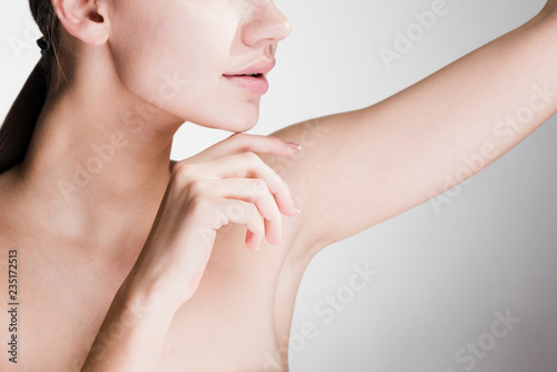 beautiful young girl showing her armpits after depilation