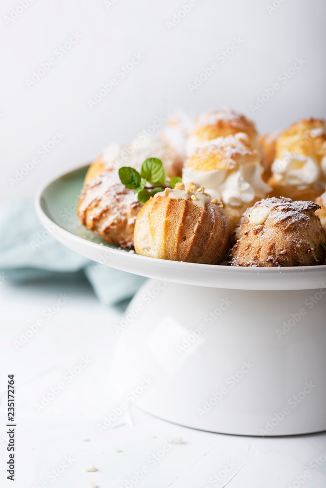 Delicious profiteroles with cream Delicious profiteroles with cream