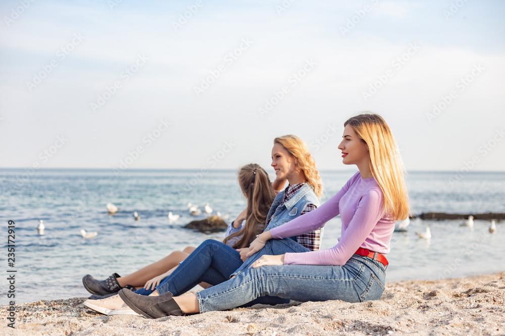 A picture of a group of women having fun on the beach A picture of a group of women having fun on the beach