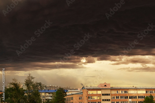 Dark Storm clouds loom over the city. Image of an impending thunderstorm