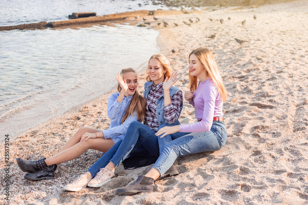 A picture of a group of women having fun on the beach A picture of a group of women having fun on the beach