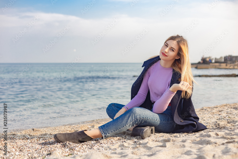 A young girl spends time on the coast