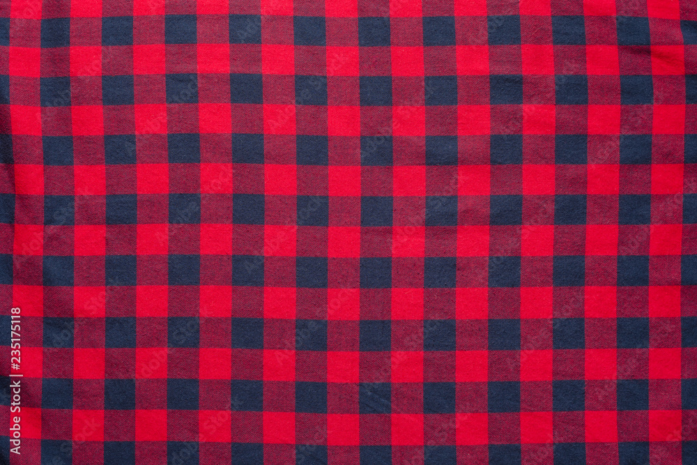 Obraz premium Checkered plaid material. Red dark blue cage clothes background