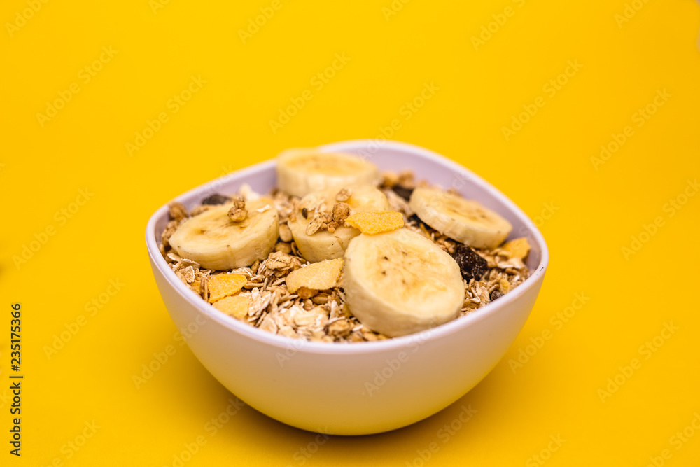 A bowl with banana, oats and cereal. A bowl with banana, oats and cereal.