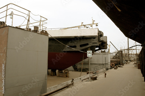 Archive 2008 River port of Ust-Danube was destroyed in of crisis. Old rusty boats on stocks in dry dock of river port. Old river vessels rust on dock repair shop stocks for repair of river vessels