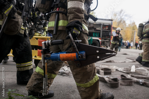 Firefighters work on an extrication using a hydraulic rescue tool photo