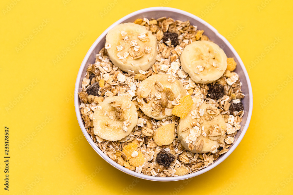 A bowl with banana, oats and cereal. A bowl with banana, oats and cereal.
