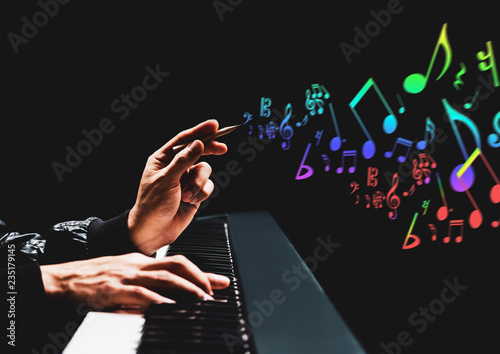 male songwriter hands composing a song on piano. song writing, music education concept