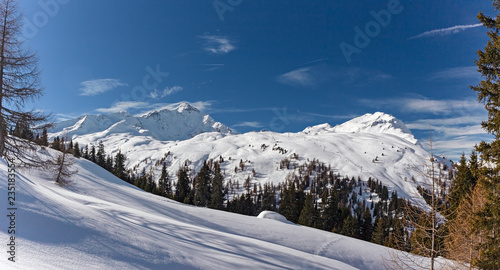Panoramic view of the snow-covered Alps in winter, in the canton of Graubünden in Switzerland.