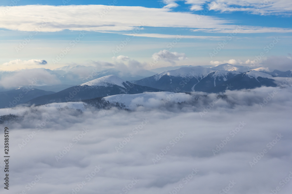 winter mountain ridge in a dense clouds winter mountain ridge in a dense clouds