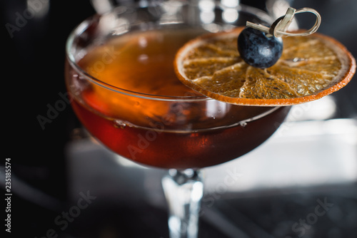 Obraz na plátně The Boulevardier Cocktail with orange chips on top. On a bar desk