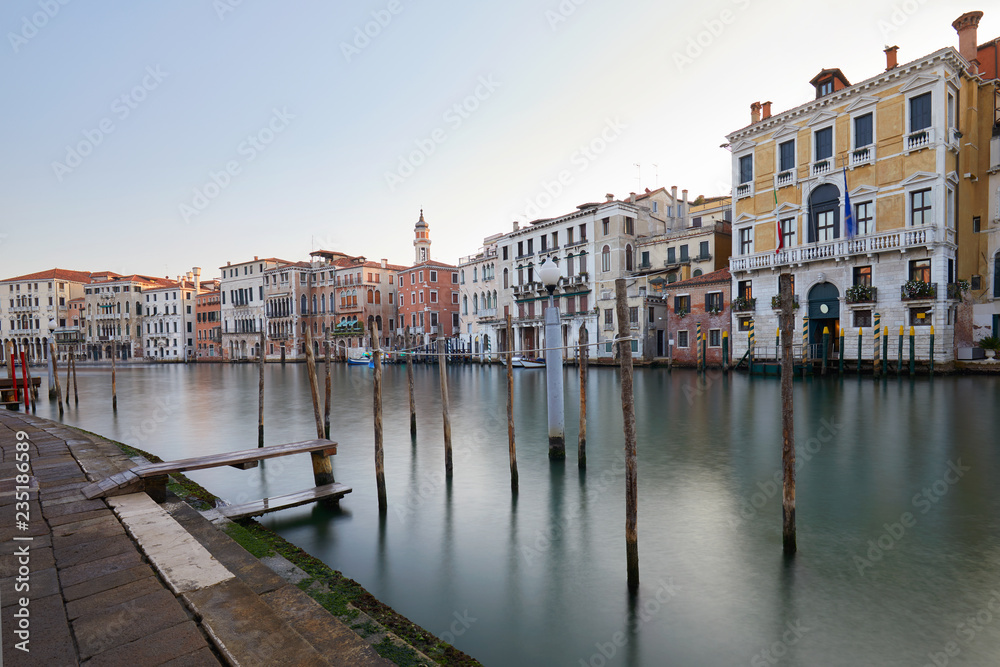 Grand Canal and docks in Venice, clear sky in summer in Italy, nobody
