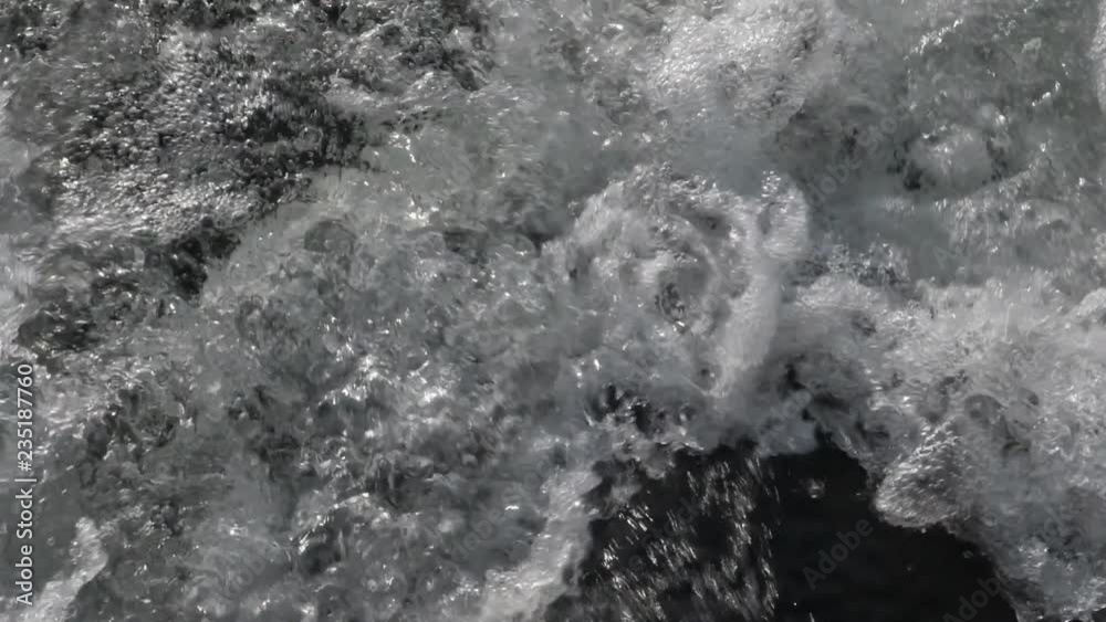 Slow motion closeup of motorboat wake. Turbulent fresh water lit up by the sun. Slow motion closeup of motorboat wake. Turbulent fresh water lit up by the sun.