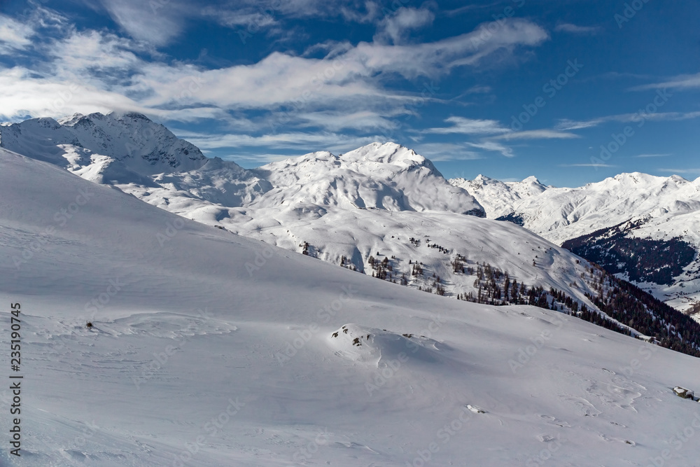 Panoramic view of the snow-covered Alps in winter, in the canton of Graubünden in Switzerland.