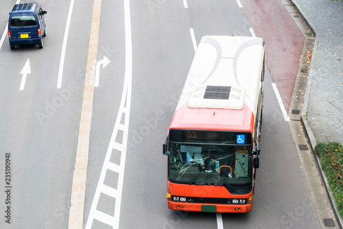 Abstract public transportation background featuring Japanese public bus service on city street in Kanazawa, Japan.
