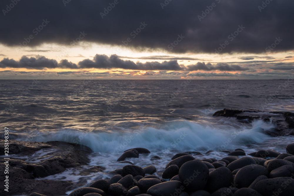 Stony coast at sunset in Iceland