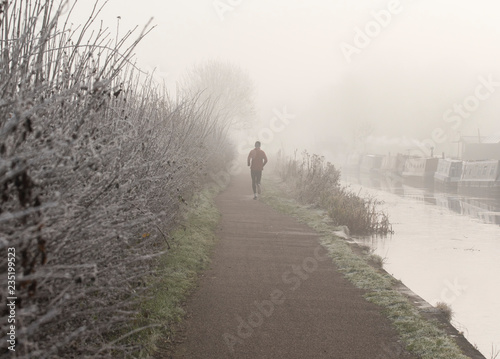 Running down a foggy towpath