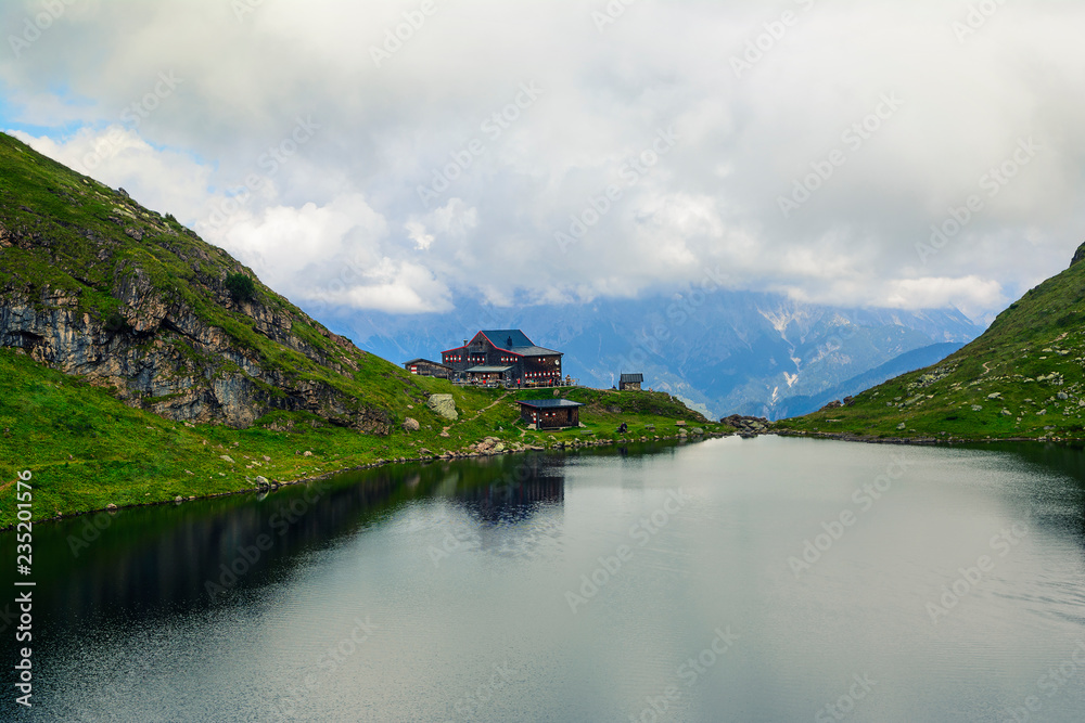 Beautiful landscape with Wildsee Lake ( Wildseelodersee ) and  the Wildseeloderhaus, mountain refuge hut, above Fieberbrunn in the Kitzbuhel Alps, Tirol, Austria