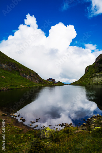 Beautiful landscape with Wildsee Lake ( Wildseelodersee ) and  the Wildseeloderhaus, mountain refuge hut, above Fieberbrunn in the Kitzbuhel Alps, Tirol, Austria photo