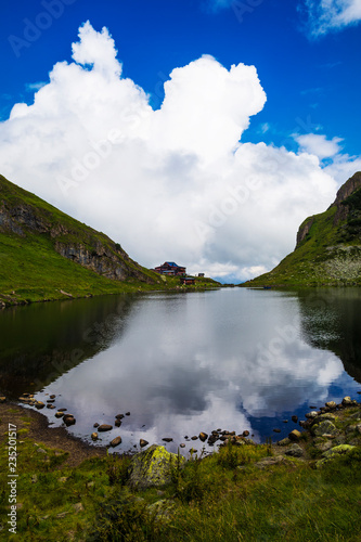 Beautiful landscape with Wildsee Lake ( Wildseelodersee ) and  the Wildseeloderhaus, mountain refuge hut, above Fieberbrunn in the Kitzbuhel Alps, Tirol, Austria photo