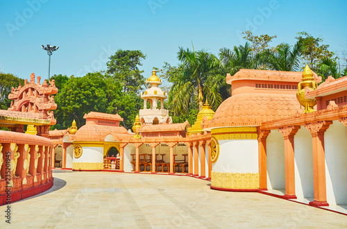 Walk around the pagoda of Sitagu International Buddhist Academy and enjoy its beautiful architecture with ornate stucco decors, Sagaing, Myanmar. photo