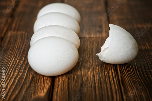 White chicken eggs on a wooden rustic table. Natural