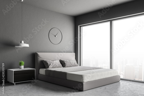 Gray loft bedroom corner with clock