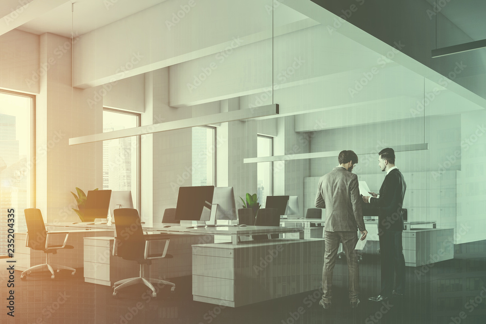 Fototapeta premium White office with lockers, side view, men