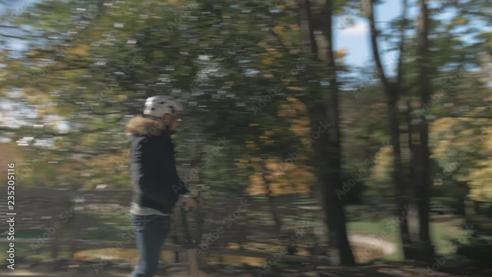 Slow Motion of Modern Man Crossing a Bridge on Electric Scooter 1 Slow Motion of Modern Man Crossing a Bridge on Electric Scooter 1