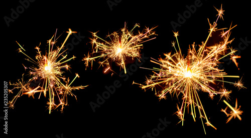 Set of Christmas sparkler burning isolated on black background.