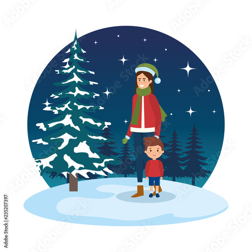 mother and son with christmas clothes in snowscape