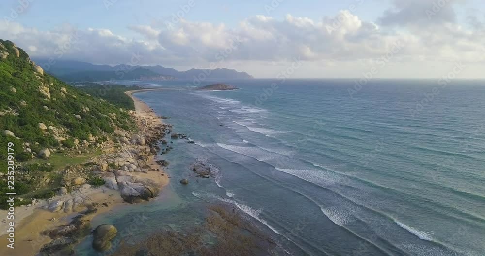 Aerial view of beautiful tropical island beach from drone. Stock footage of landscape of paradise tropical island beach with blue color ocean water, wave, sea surface. Top view and amazing nature Aerial view of beautiful tropical island beach from drone. Stock footage of landscape of paradise tropical island beach with blue color ocean water, wave, sea surface. Top view and amazing nature
