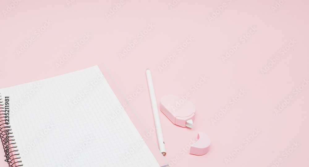 Notebook, white sheet, pencil, proofreader. Pink background.Instagram concept