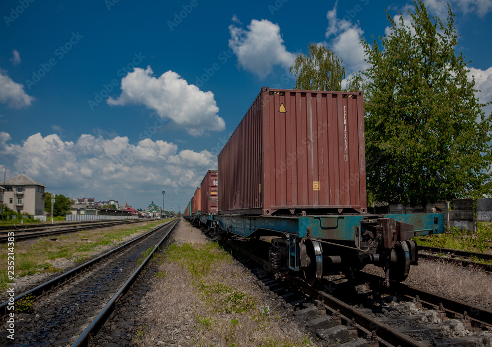 Container loaded on train wagons on a railway Container loaded on train wagons on a railway