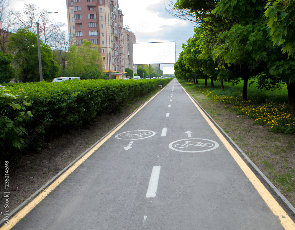 Painted signs on asphalt for bicycle dedicated lanes. A separate bike path in the city