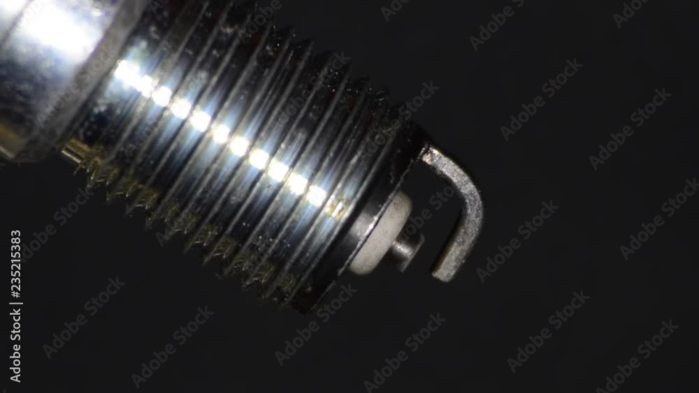 Car candle, principle of operation, blue spark. Macro. Car candle, principle of operation, blue spark. Macro.