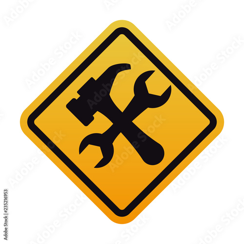 caution signal with wrench and hammer