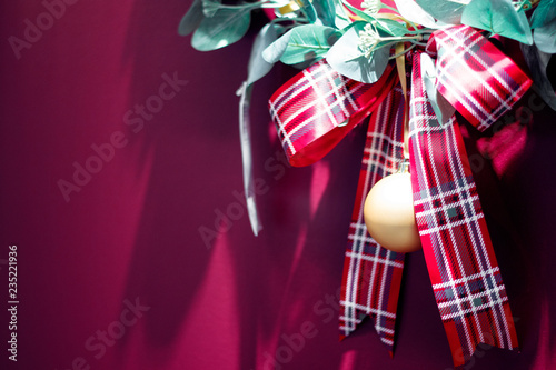 Red christmas gift ribbon on red background