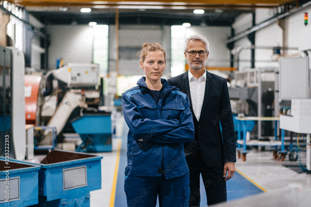Manager and skilled worker of a high tech enterprise having a meeting Manager and skilled worker of a high tech enterprise having a meeting