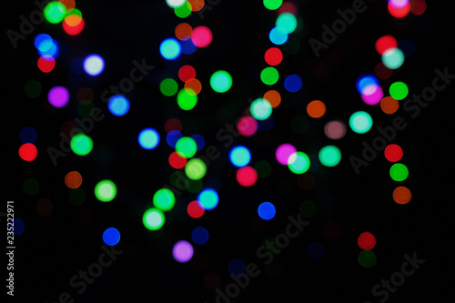 festive abstract defocused led lights on black background