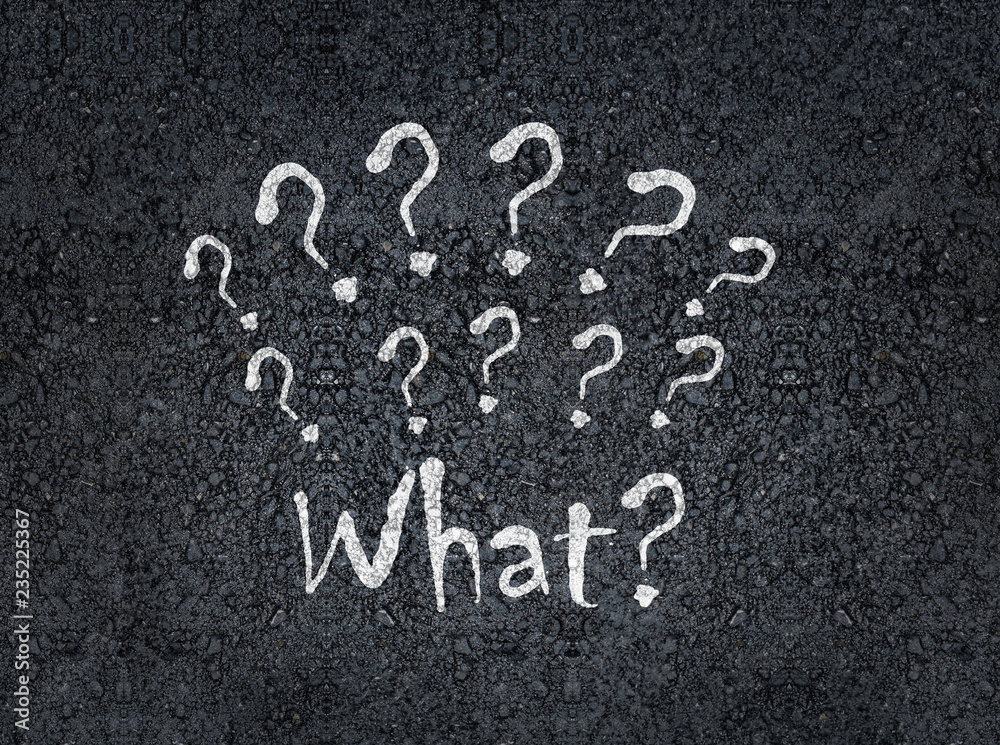 Fototapeta premium what with question marks painted on asphalt