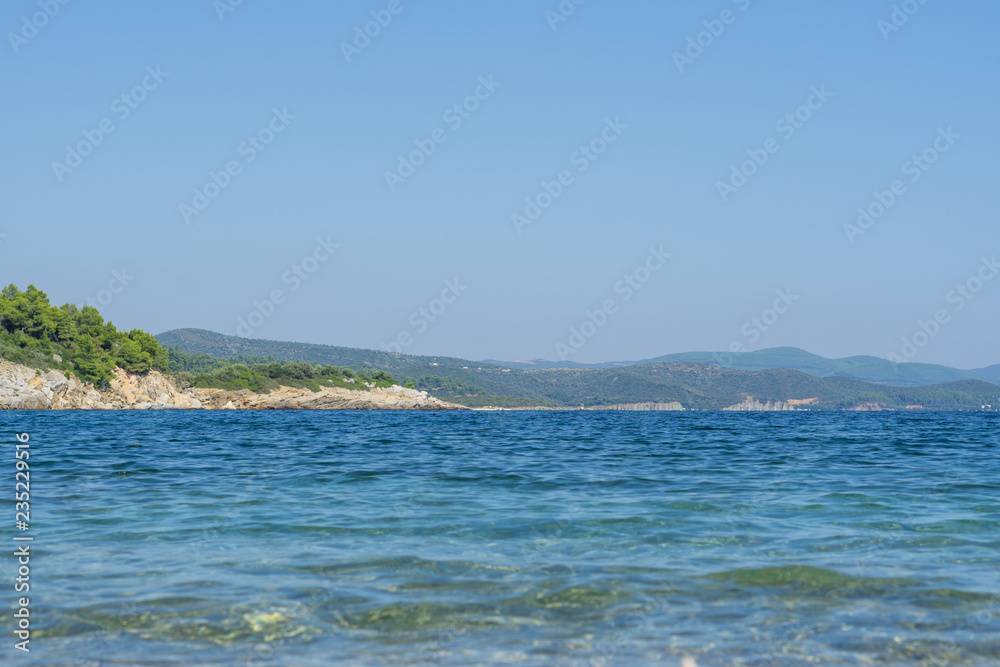 Sea water on sunny day, nature background. Ocean view on sunny summer day