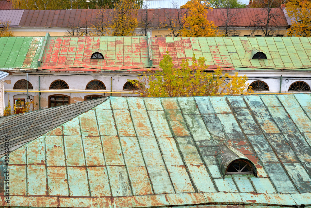 Rusty roofs of old houses in fall,  Rostov, Yaroslavl region, Russia