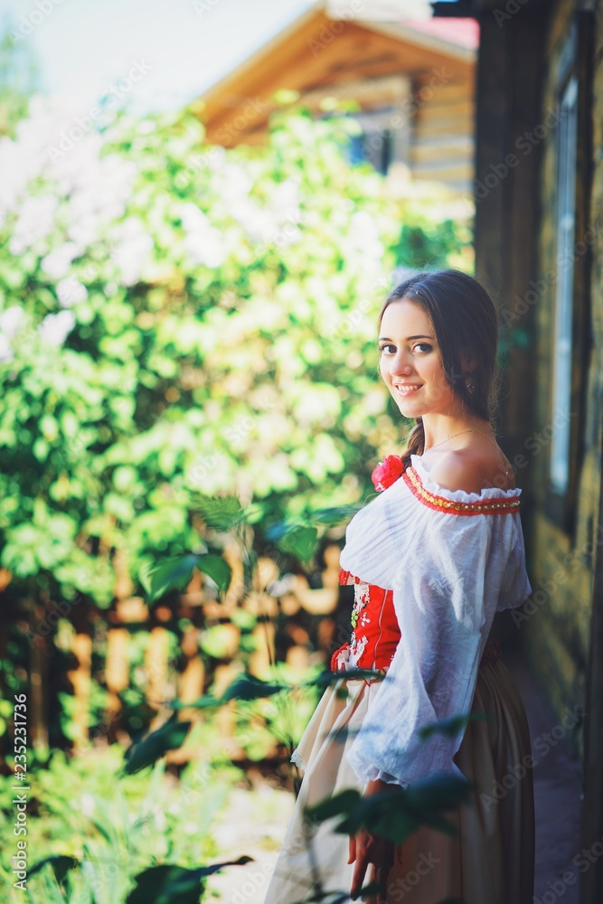 Beautiful young Russian girl in national costume Beautiful young Russian girl in national costume
