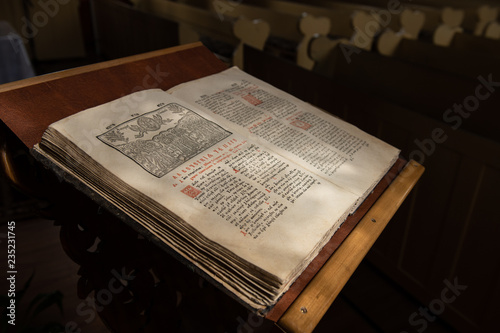 Old Christian manuscript written in Cyrillic on church pulpit. photo