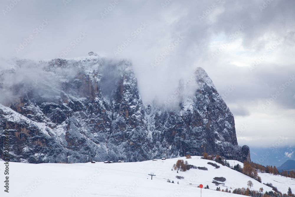 snowy early winter landscape in Alpe di Siusi. Dolomites, Italy - winter holidays destination snowy early winter landscape in Alpe di Siusi. Dolomites, Italy - winter holidays destination