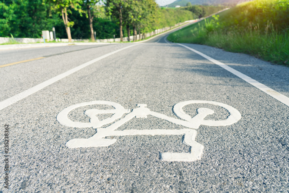Obraz premium Bicycle sign on the road used for pedestrian crossing bicycle lane
