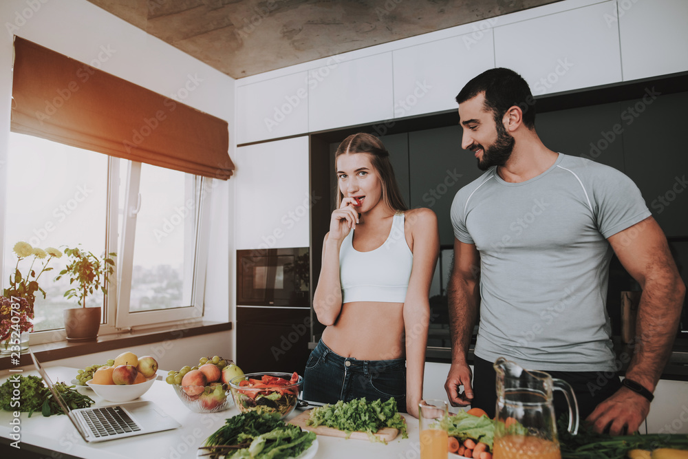 A Couple Is Preparing A Salad For A Breakfast. A Couple Is Preparing A Salad For A Breakfast.